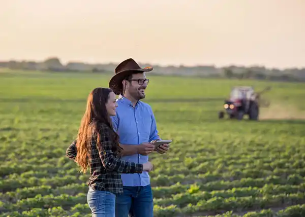 Couple Standing In Farm